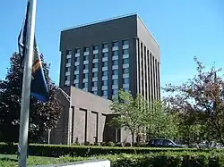 A tall brick cube-shaped building