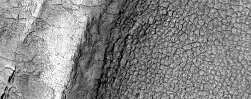 High-center polygons, as seen by HiRISE under HiWish program Image is of the top of a debris apron in Deuteronilus Mensae.