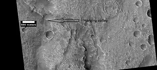 Hanging valley, as seen by HiRISE under HiWish program This may have been a waterfall at one time.
