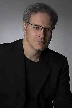 Professional headshot of Eduardo Monteiro.