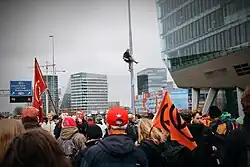 Member of the Extinction Rebellion Climbing Division high up on a pole to make arrest by the police more difficult