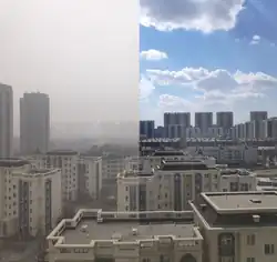 A hazy cityscape to the right and a clear one to the left