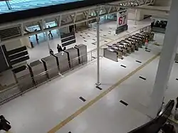 Faregates at the concourse level. The BRT and LRT are integrated with each other, therefore passengers do not need to exit the paid area to change lines.