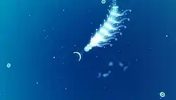 A white multi-segmented worm-like creature in the top center of the screen is shown over a blue background. Small circular creatures surround it, and below it are smaller, blurry worm-like creatures.