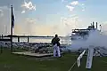 Firing signal cannon at Fort James Jackson
