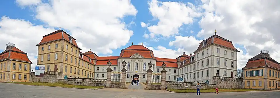 The entrance front of Fasanerie palace (during the renovations, with the middle and right in the original white colour)