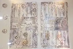 Photograph in plan view of the gaming set showing triangular points and assorted gaming pieces