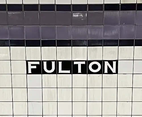 Tile caption below trim line