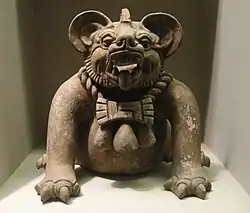 A funerary urn in the shape of a "bat god" or a jaguar, from Oaxaca, Mexico, dated to 300–650 CE. Height: 9.5 in (23&nbsp;cm).