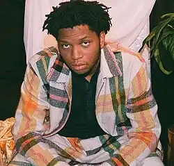 Gallant with plaid suit