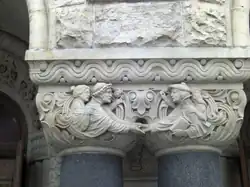 Facade capital indicating the arrival hall.