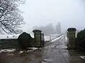 The estate's gated entrance and driveway