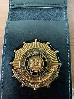 The badge of an Assistant District Attorney in Genesee County, NY.