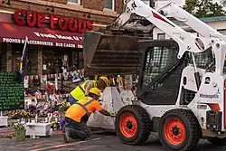 City crews removed barricades but also installed a protective barrier around the location where Floyd died, June 3, 2021