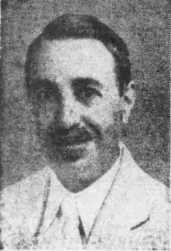 Head of a man with a moustache looking at the camera
