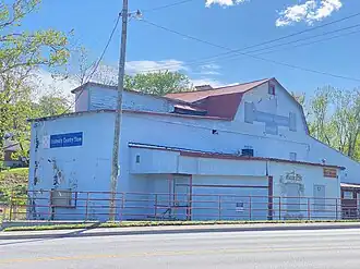 A photo of the exterior of an historic mill pictured in the daytime