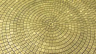 Closeup of one of the golden discs.