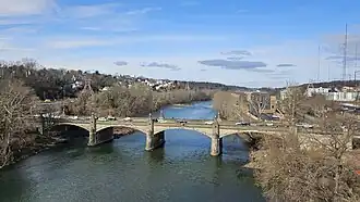 A color photograph of a bridge over a river
