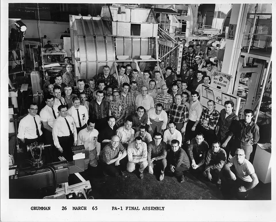 Grumman Aircraft Engineering Corporation manufacturing team with Lunar Module PA-1 ascent stage fuselage.