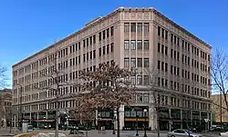 A five-story urban building in a downtown area