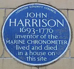 Blue plaque commemorating Harrison in Red Lion Square in London
