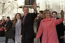 The Clinton family walking and greeting the crowds