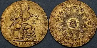 Both sides of a gold coin, depicting a seated figure and an allegorical all-seeing eye