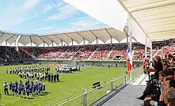 Photo from the stands of players and officials on the pitch