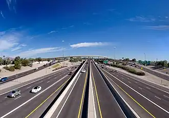 Looking over a highway towards an elevated interchange