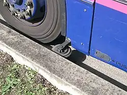 The kerb guide wheel of a bus in Ipswich, UK