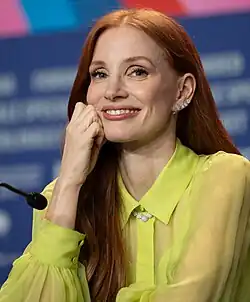 Chastain smiling at the camera