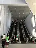 Escalators just after the pedestrian link entrance at the KLIA Ekspres arrival hall