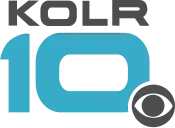 Gray wide letters KOLR above a teal, somewhat futuristic 10 with squarish sides. The CBS eye in gray overlaps the 0 in the lower right with a white cutout.