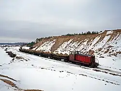 Locomotive TU7-1231 with freight train