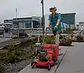 A sculpture of a man and a lawn mower, by Hannah Kidd[28]