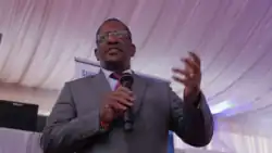 Keriako Tobiko holding a microphone and talking