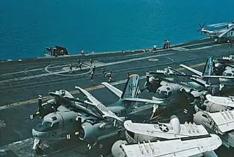 The USS Kitty Hawk CV-63 in Singapore harbour circa 1973/74. The aircraft visible are an S-2G Tracker anti-submarine aircraft. The S-2G to the left (NH-721) was assigned to anti-submarine squadron VS-37, the aircraft on the right (NH-714) to VS-38. The Kitty Hawk was deployed to the Western Pacific with "Carrier Air Wing 11 (CVW-11)" from 23 November 1973 to 9 July 1974.