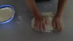 Working the dough by hand
