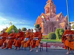 Monks relaxing in Lam Plai Mat's city center