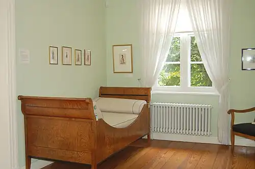 Sleigh bed (c. 1820/1830) in the Helgoland room, Museum Langes Tannen, Uetersen, Germany