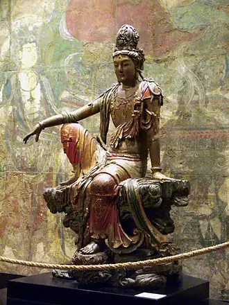 Guanyin of the southern seas (Chinese), 11th–12th centuries, painted and gilded wood, Nelson-Atkins Museum of Art, Kansas City, USA[19]