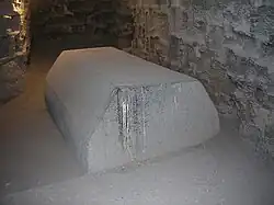 Lid of abandoned sarcophagus near the entrance