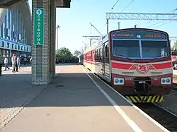 Red-and-white train at a station