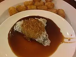 Kue lupis - Glutinous rice cake with grated coconut and liquid palm sugar