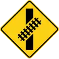 W10-12R Skewed crossing ahead (right) (this supplements the W10-1 sign but does not replace it)