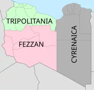Map of Libya, split into three sections. The north and west, coloured green, is labelled "Tripolitania". South of Tripolitania, extending into the Sahara desert, is Fezzan, coloured red. The entire east of the country is labelled "Cyrenaica" and is coloured grey.