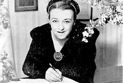 Photograph of María Grever composing music