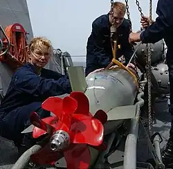 A Mark 46 Mod 5A torpedo is inspected aboard the guided missile destroyer USS&nbsp;Mustin.
