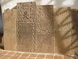 Gravestone (second from the left), in Malacca's St. Paul's Church, of Peter Martinez consecrated as the second bishop of Japan in Goa, 1595 and arrived in Nagasaki, 1596. He left in 1597 following the deaths of the 26 Martyrs of Japan. Died en route to Goa in February 1598.[7]