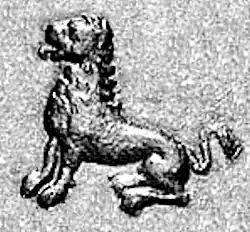 The lion on Menander II's coins is similar to those on the Pillars of Ashoka: seated posture, protruding tongue, mane (detail of Indian-standard square coin of Menander II).